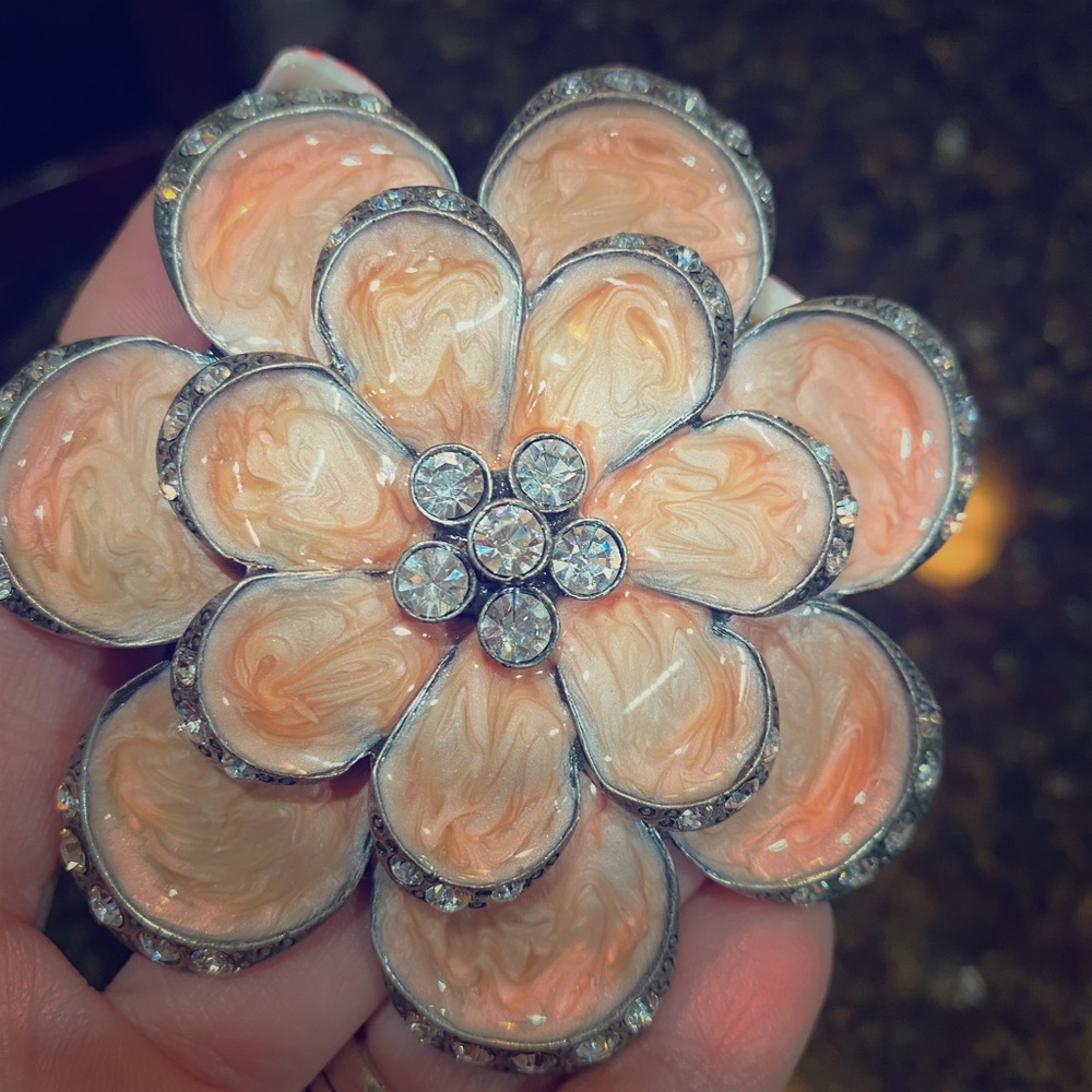 Silver, peach-pearl and rhinestone belt buckle.